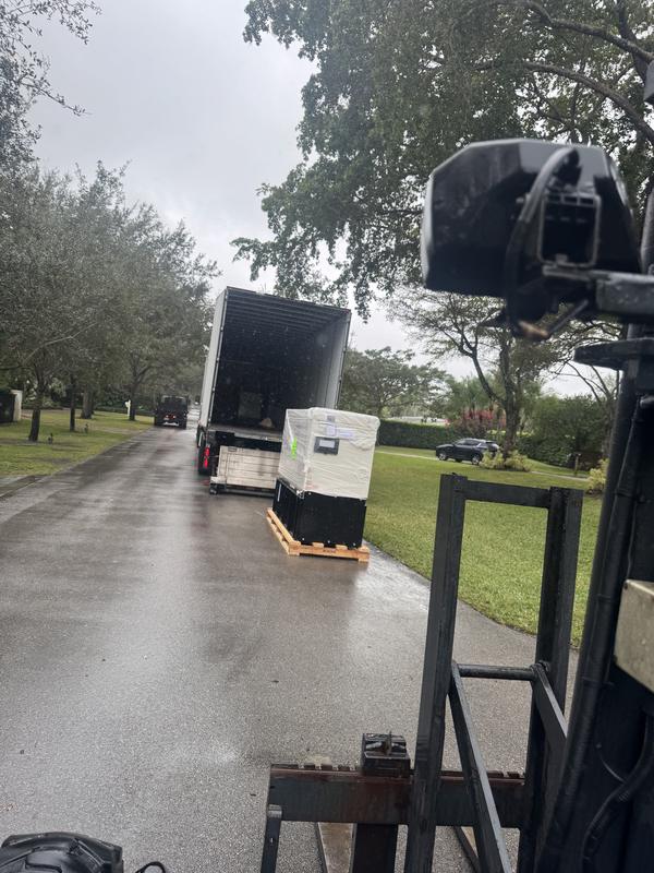 Generator delivery by forklift on a rainy day