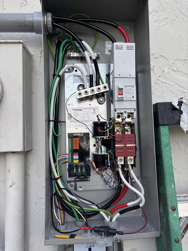 Automatic transfer switch wiring inside an open panel